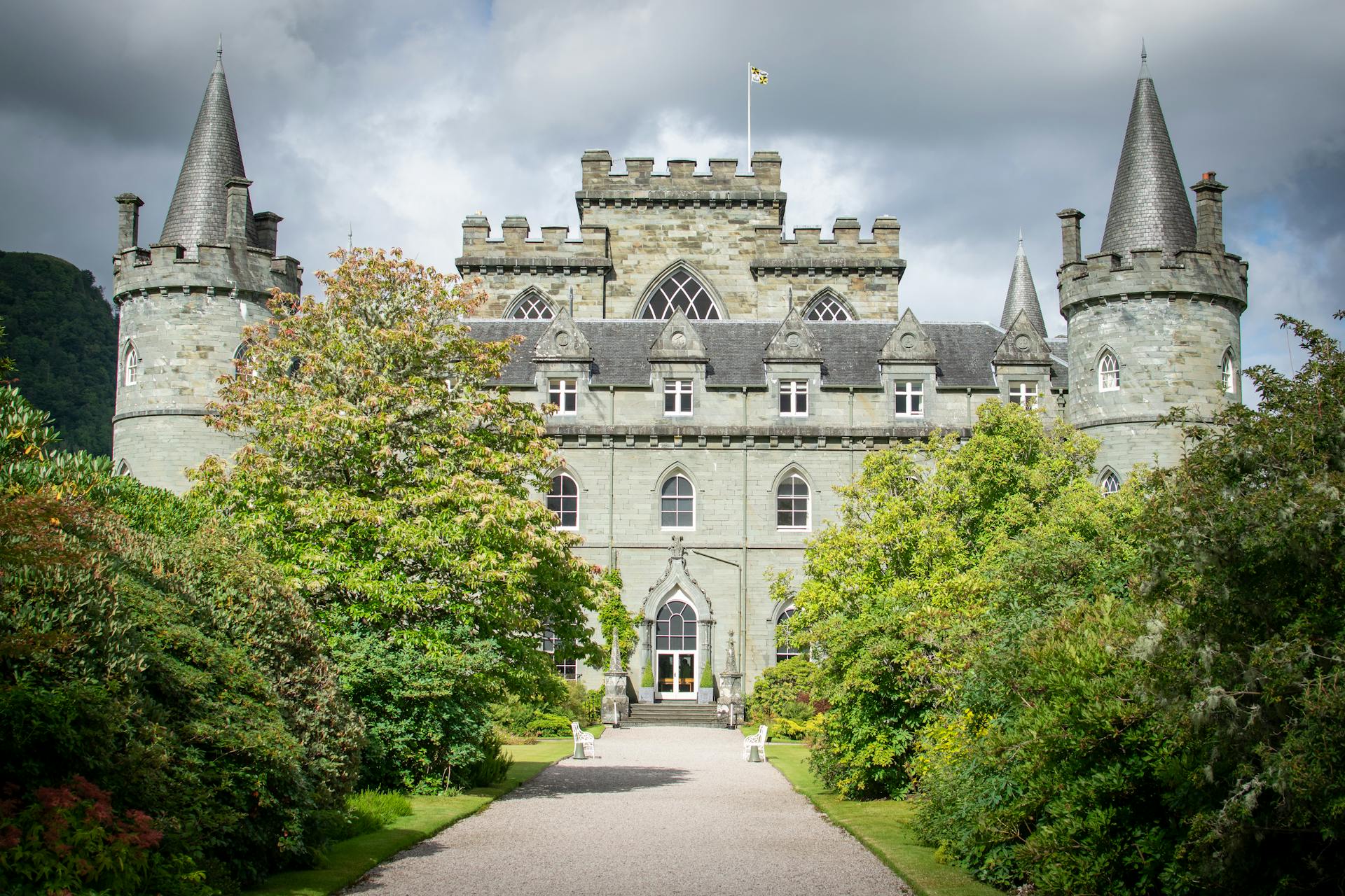 Luxury Scottish castle hotel exterior with turrets and manicured grounds